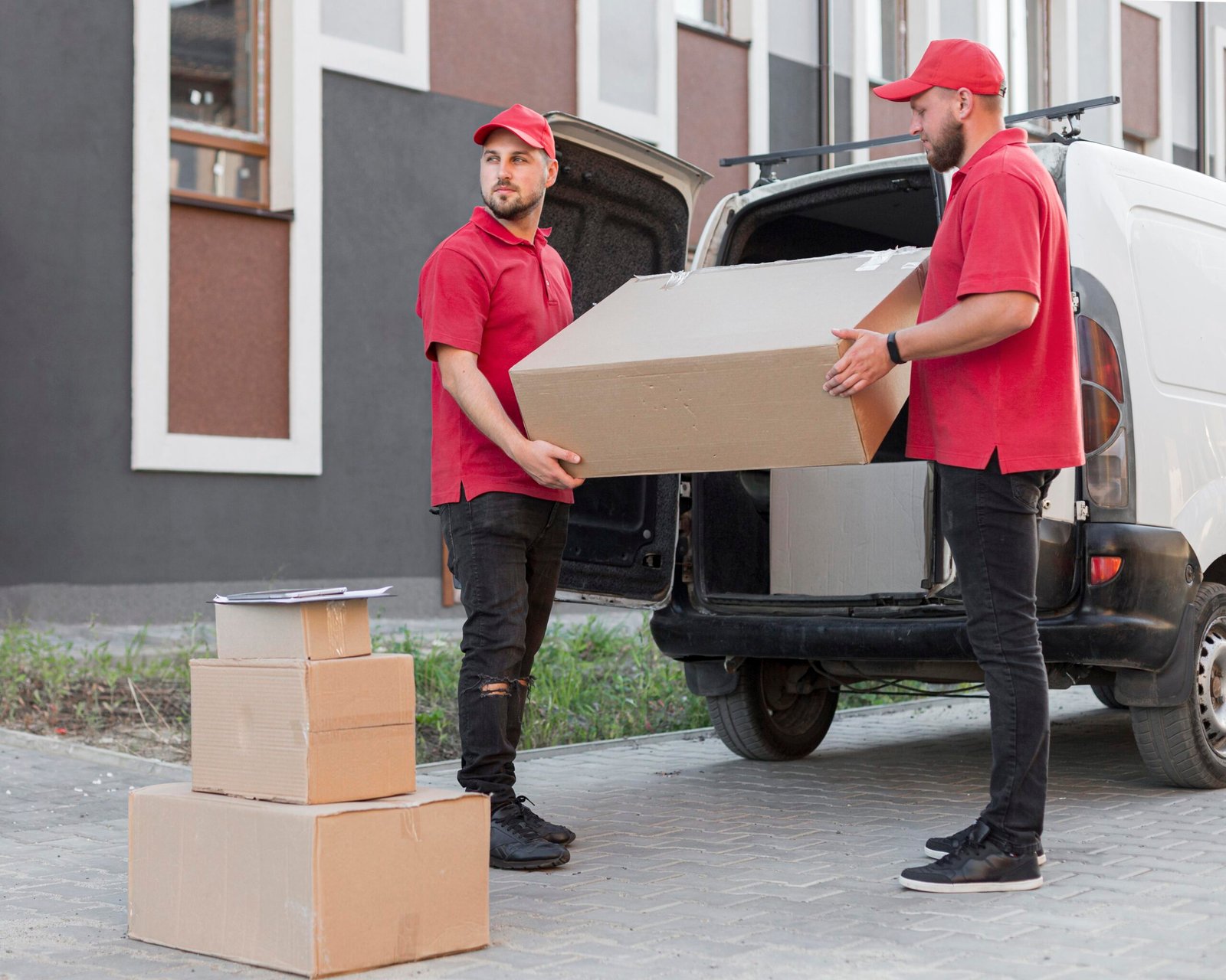 Professional movers in Fujairah loading household furniture into a moving truck